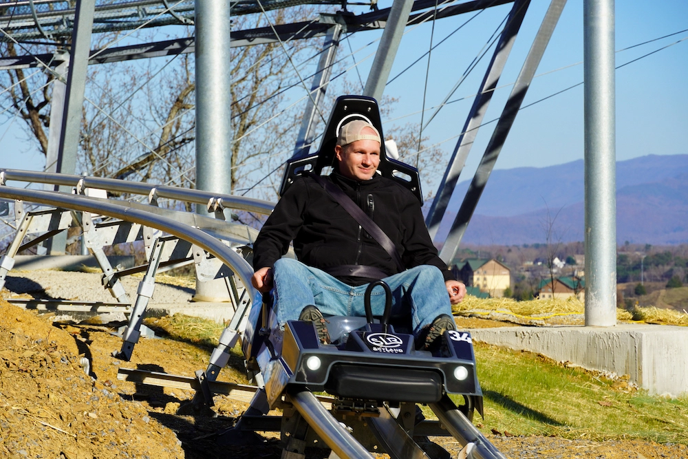 guest riding The Wild Stallion mountain coaster at SkyLand Ranch
