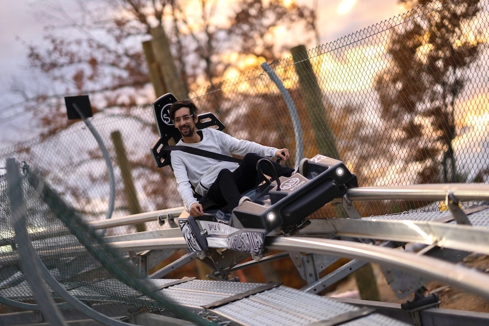 Man riding The Wild Stallion Mountain Coaster