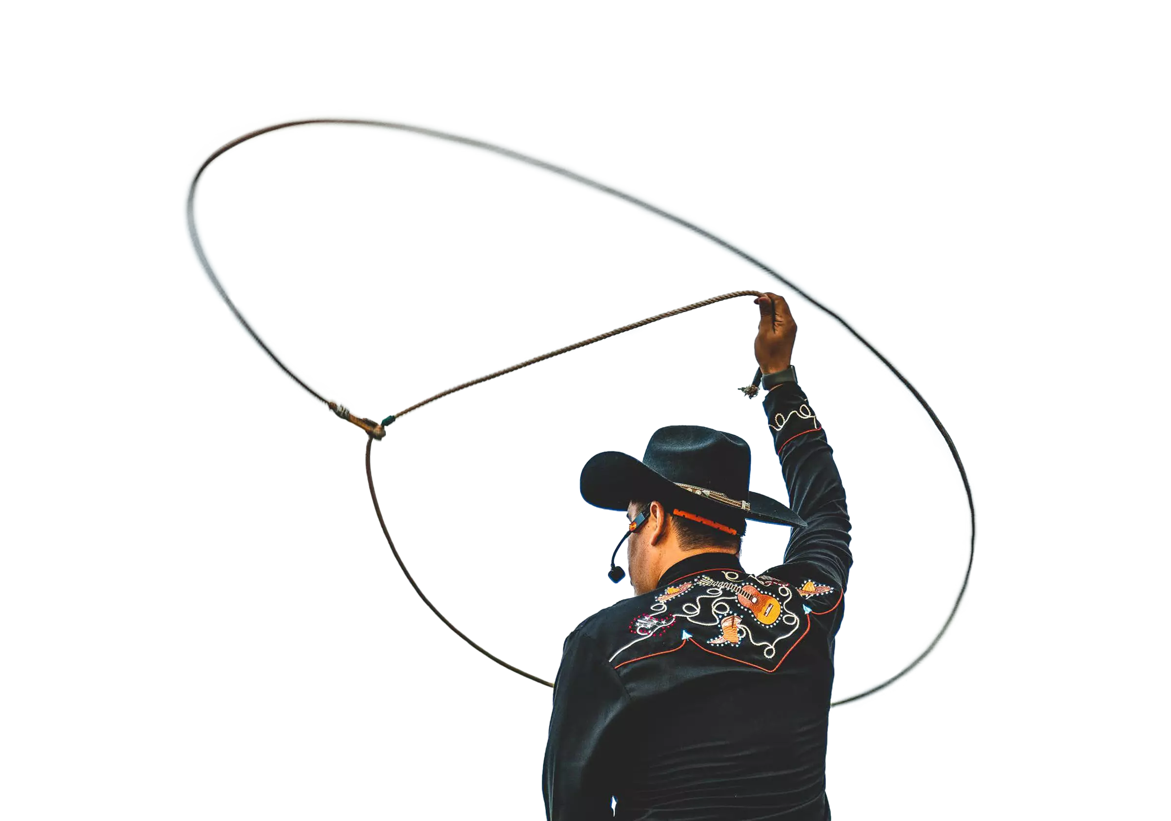 man throwing a lasso up into the air 