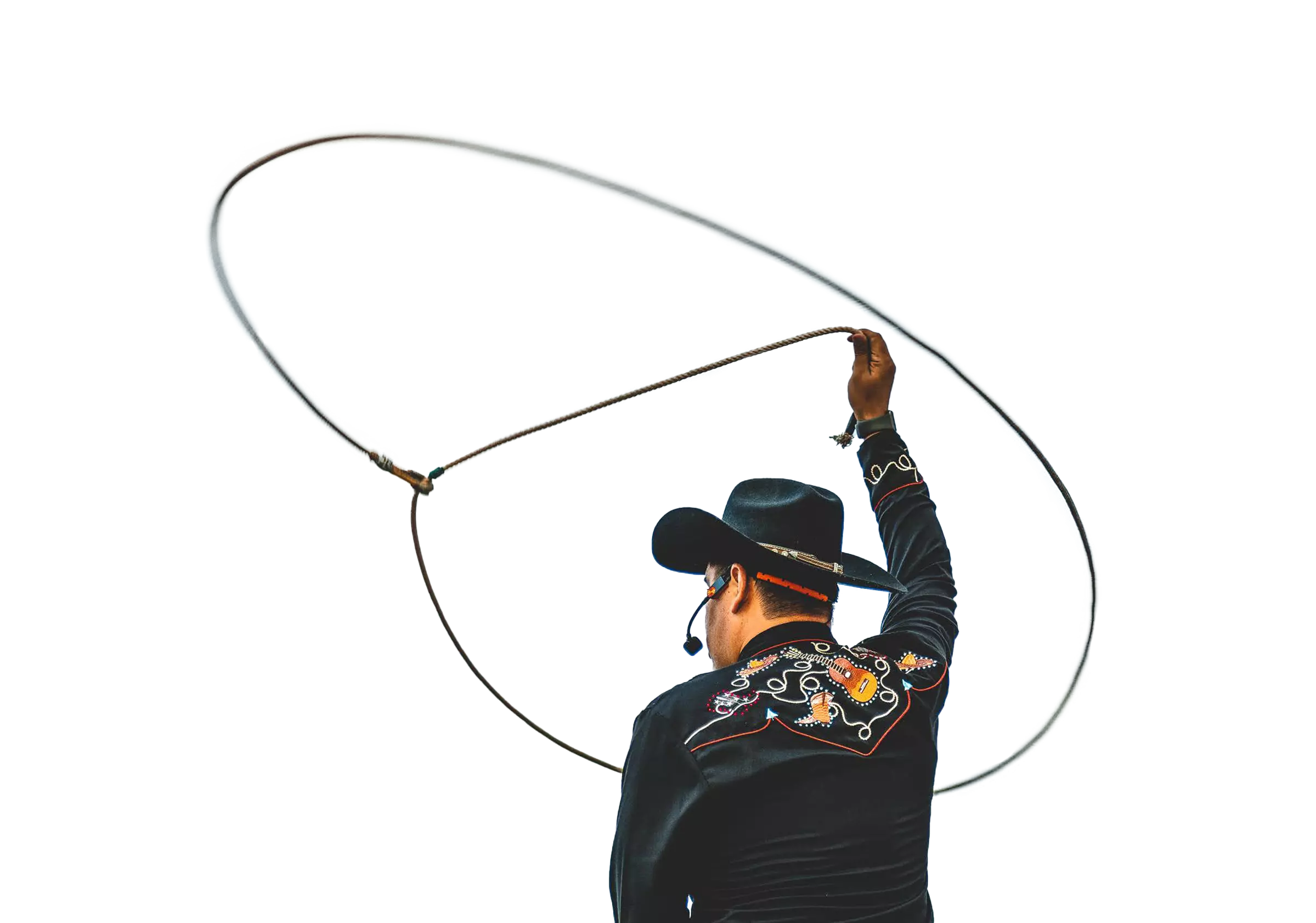 man throwing a lasso up into the air
