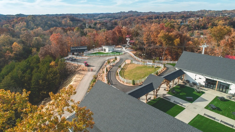 aerial view of SkyLand Ranch surrounded by fall foliage