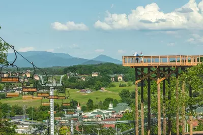 view from the top of SkyLand Ranch with chairlift and Legacy Lookout in front of mountain landscape