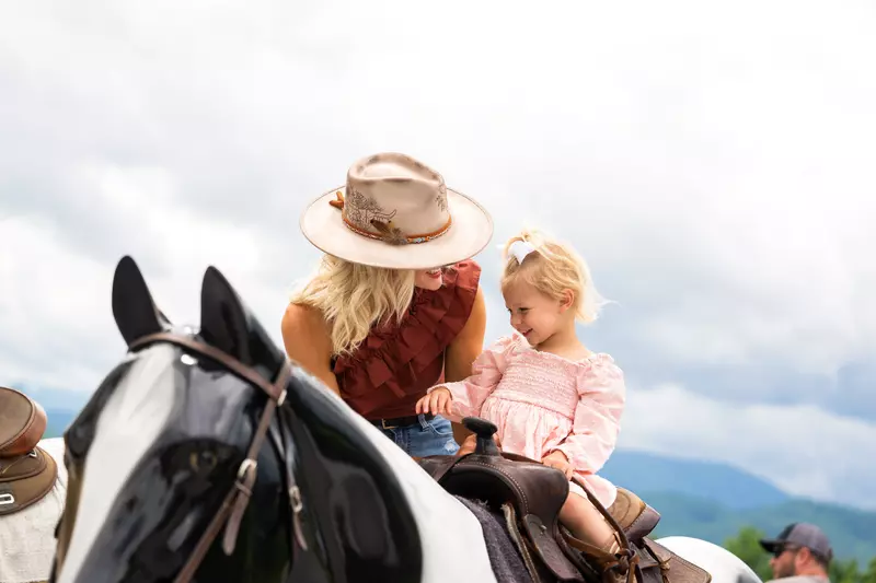 mom and daughter on horse