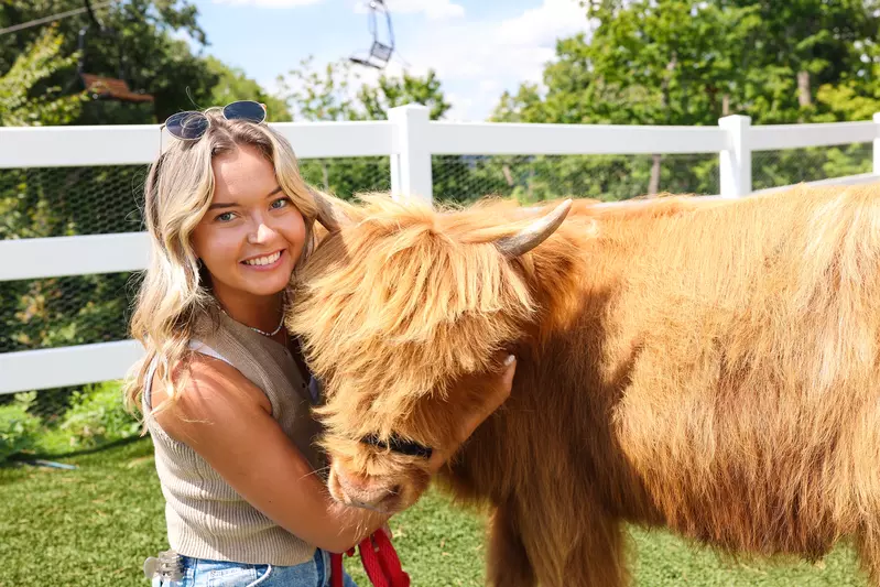 girl with miniature cow