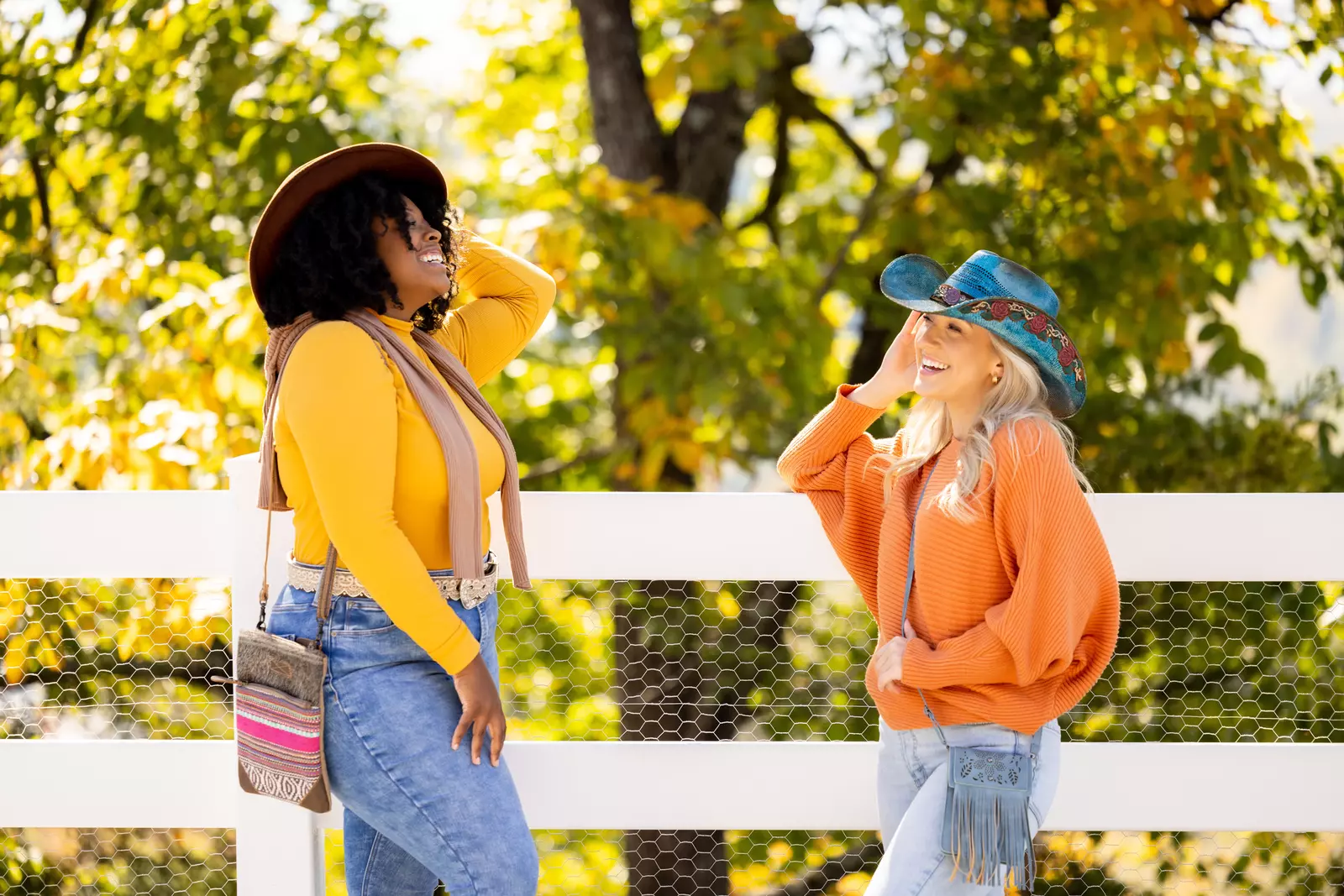 girls laughing at SkyLand Ranch during the fall